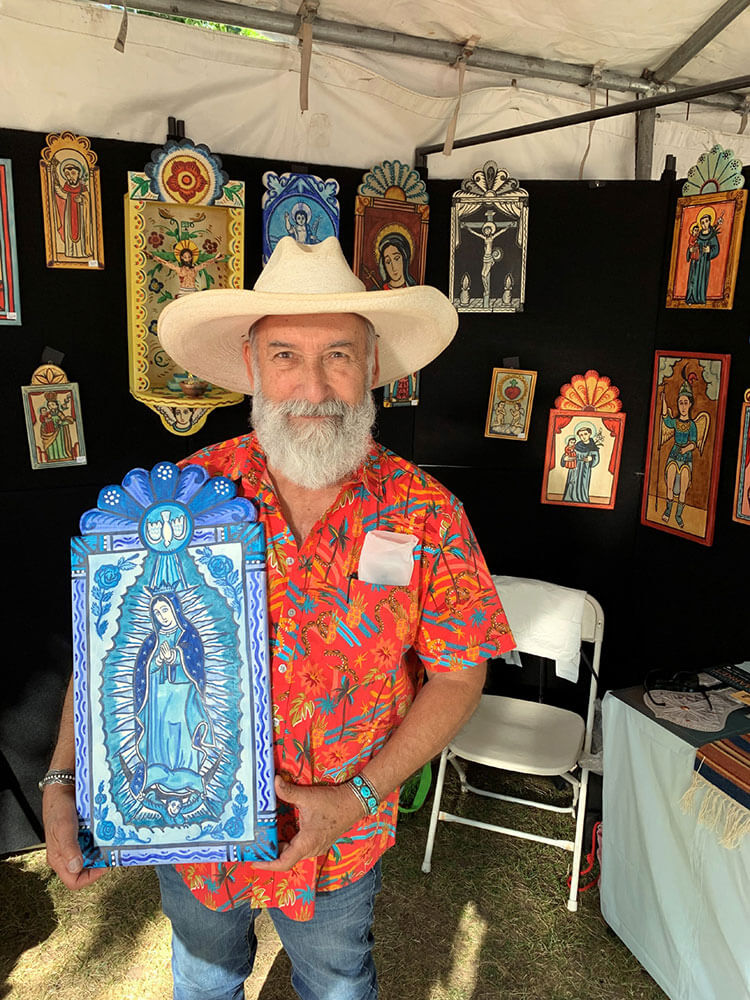 New Mexican Retablos with Charles M. Carrillo 11 Photo of Charles M. Carrillo in his booth.